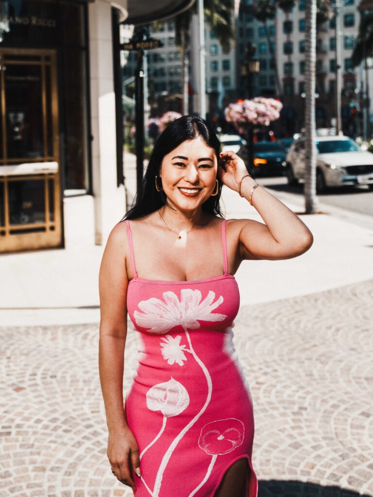 Close-up portrait of Tammy Veneza in pink dress on Rodeo Drive Beverly Hills, luxury editorial photography by Johnny Hann